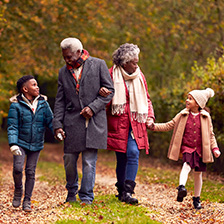 Family walking through forest for Flu 2022 campaign