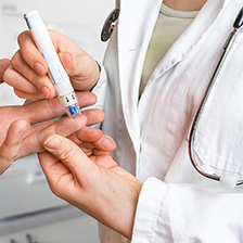 Doctor with diabetes testing tool