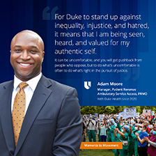 adam moore smiling with crowd in background