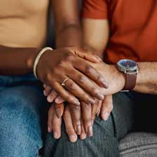 Two people holding hands