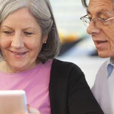 woman with doctor looking at book