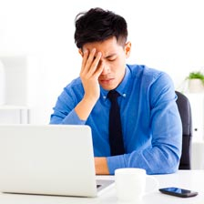 Man with hand on face