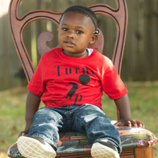 Boy sitting on chair