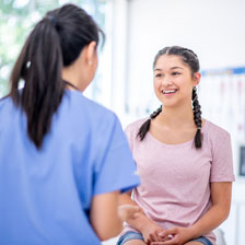pediatric patient smiling at nurse