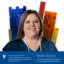 Donna smiling in blue blouse with colorful Duke shield in the background.