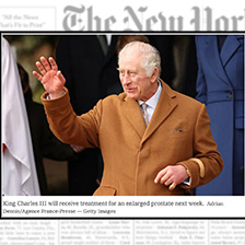 King Charles III in front of New York Times banner