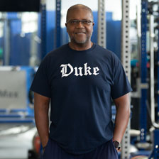 William Stephens stands in Duke University’s basketball weight room where he trains Blue Devils players