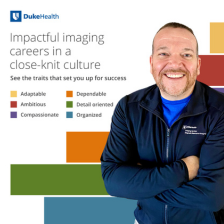 Male imaging team member smiling in Duke blue. 