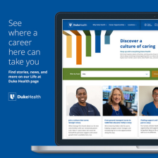 Computer screen showing the page with team members smiling faces.
