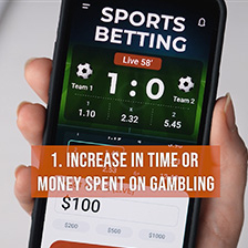 Sports betting app open in a person's hand