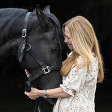 Kim Barnard embraces her horse 
