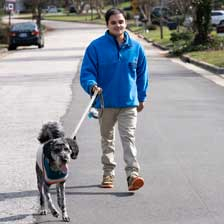 Tyler Farley walks his dog