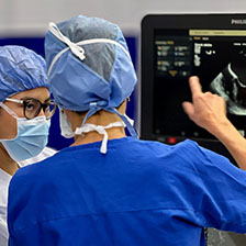 Medical professionals look at medical scan in an operating suite