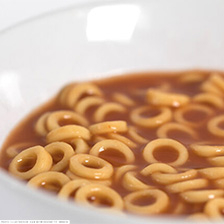Bowl of ringed pasta in tomato sauce