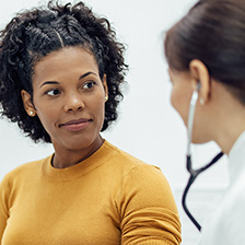 a woman looks at the doctor