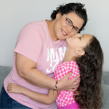 Eliana holds her daughter