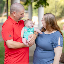 Shannon and Davis hold their baby Eli