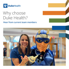 Nursing team member smiles in blue scrubs with the Duke blue devil.