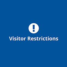 Exclamation point in a circle with Visitor Restrictions message