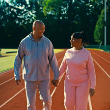 Jeff walks on the track with his wife Victoria
