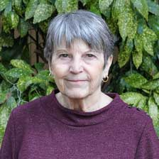 Lynne Barrett standing in front of a tree looking at the camera