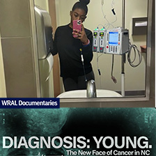 Young woman takes a selfie in a bathroom mirror with medical equipment nearby