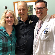 Patient and family hug a physician