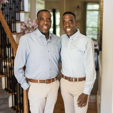Jamont and Javon smile in their home