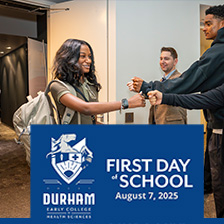 Student fist bumps teachers on way in to school