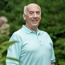 Don smiles at the camera 