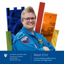 Erin smiles in a blue Duke Life Flight suit with a colorful Duke Health shield in the background.