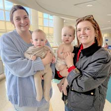 From left, Kassie and J.R. Riley and Grace and Rhian Ray meet up during follow-up appointments at Duke Children's Hospital & Health Center.