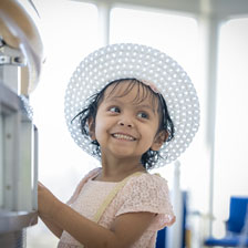 Sophia smiles while playing at the hospital