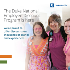 Three smiling women standing together in colorful clothing. The text reads, "The Duke National Employee Discount Program is here" with "Duke Health" logo. Additional text states, "We’re proud to offer discounts  on thousands of brands and experiences.”
