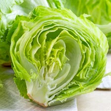 A halved head of iceberg lettuce